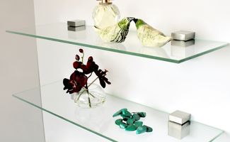 glass shelves with objects placed upon them