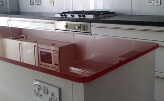 a coloured toughened kitchen worktop finished in red